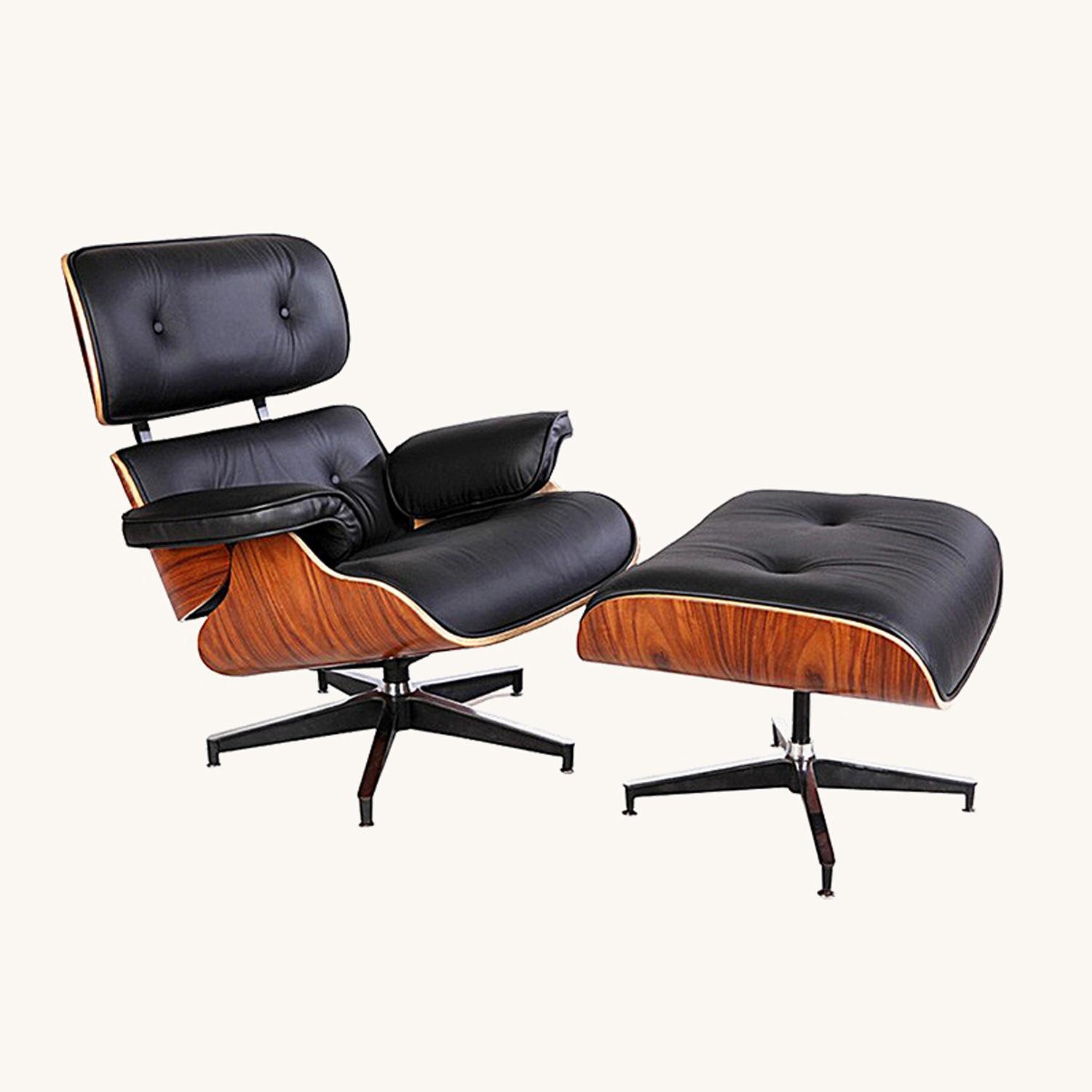 Eames lounge chair in black leather with a natural rosewood shell and ottoman, front view.