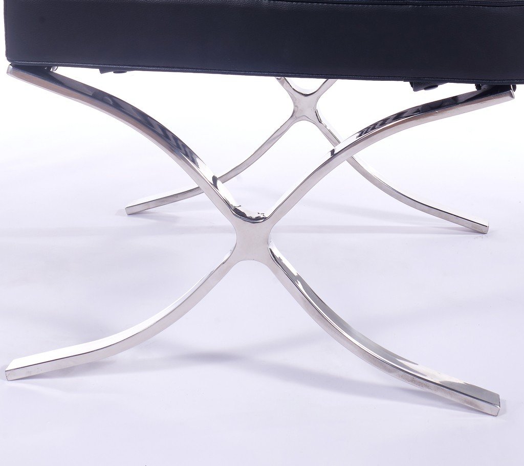 Polished steel X-frame of an affordable black Barcelona chair, mirror finish and riveted straps.