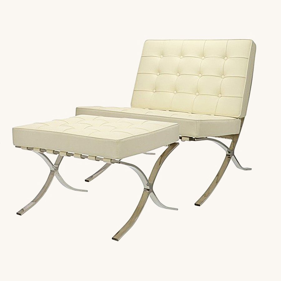 Cream Barcelona chair and ottoman replica in tufted leather on a polished steel X-frame, front view.