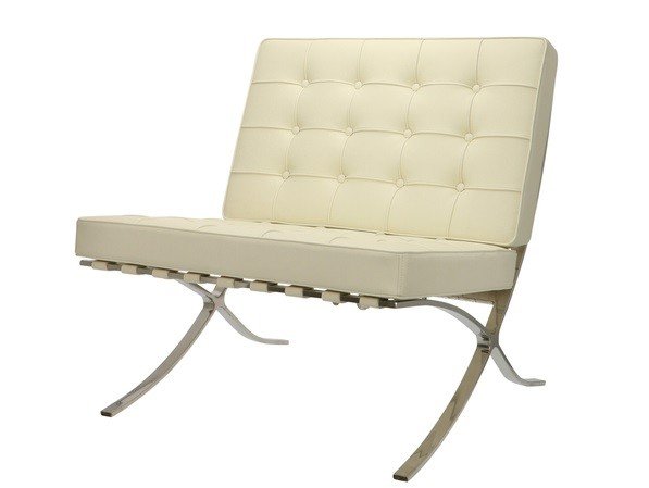 Barcelona chair in cream leather at an angle, Mies van der Rohe and Lilly Reich design.