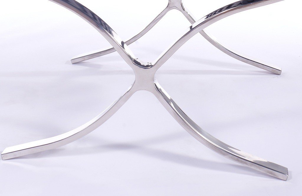 Polished steel X-frame of Barcelona chair, mirror finish with riveted straps.