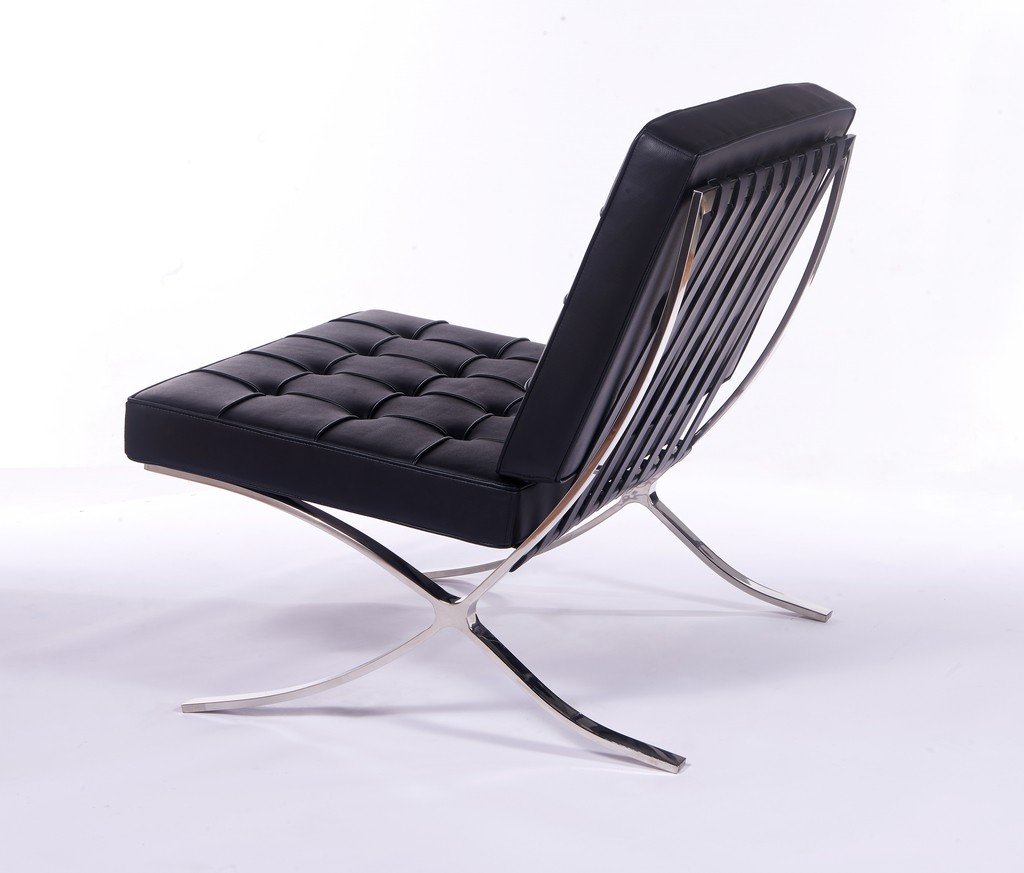 Black Barcelona chair replica on its own, deep-buttoned leather on a polished steel X-frame.