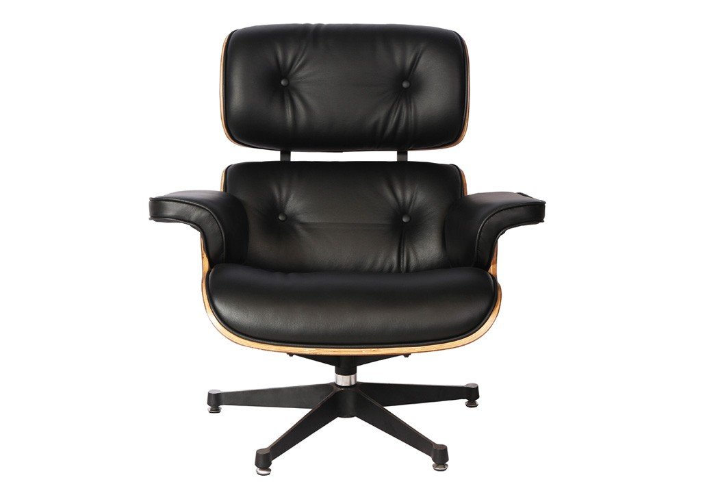 Close-up of black leather cushions on an Eames lounge chair, hand-sewn and welted.