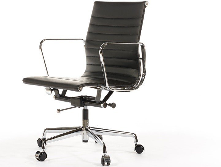 Black leather ribbed office chair seen from the side, slim low-back ribbed panels.