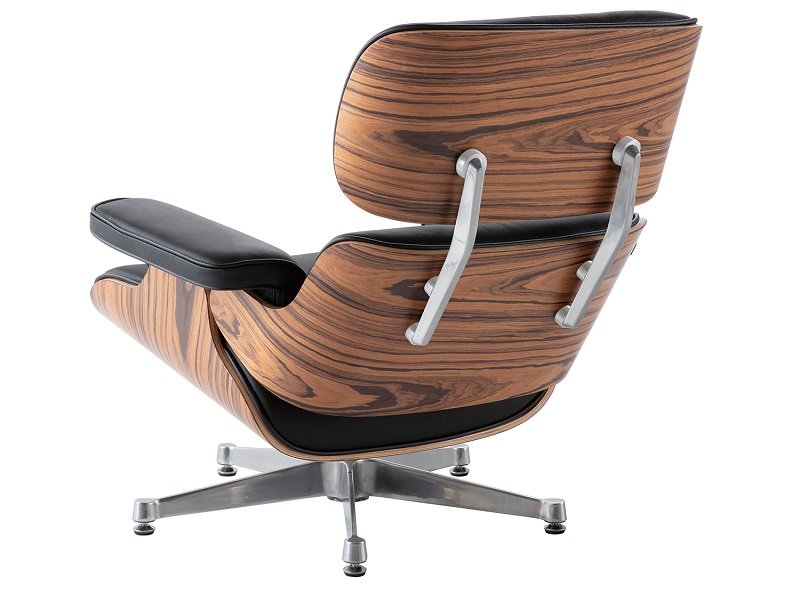 Side angle view of a single black rosewood chrome eames chair showing the classic ergonomic tilt.