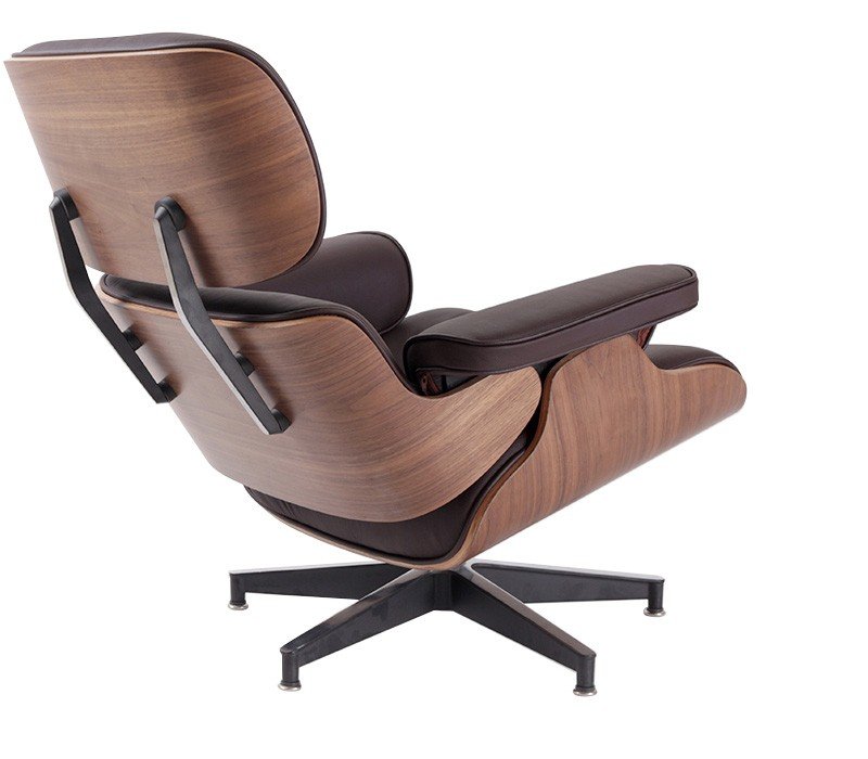 Polished aluminium base of a brown walnut Eames lounge chair with a 360-degree swivel.