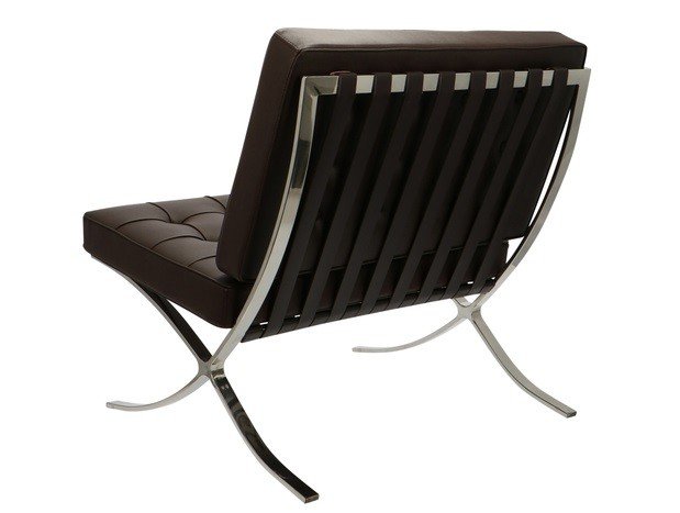 Dark brown Barcelona chair seen from the side, showing the cantilevered X-frame curve.