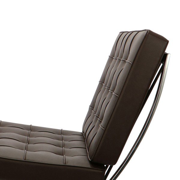 Dark brown Barcelona chair seen from the side, showing the cantilevered X-frame curve.