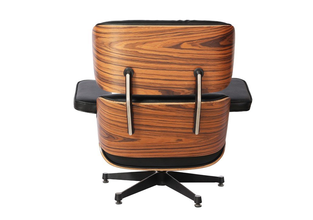 Eames lounge chair in black leather and rosewood seen from the back, deep reclined seat.