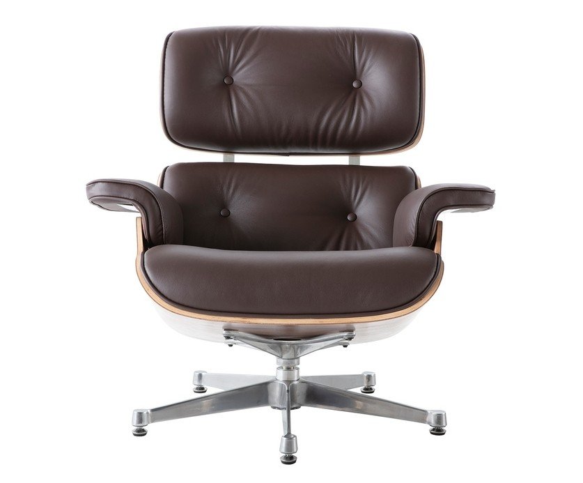 Close-up of brown leather on an Eames lounge chair, welted piping and hand-sewn cushion seams.