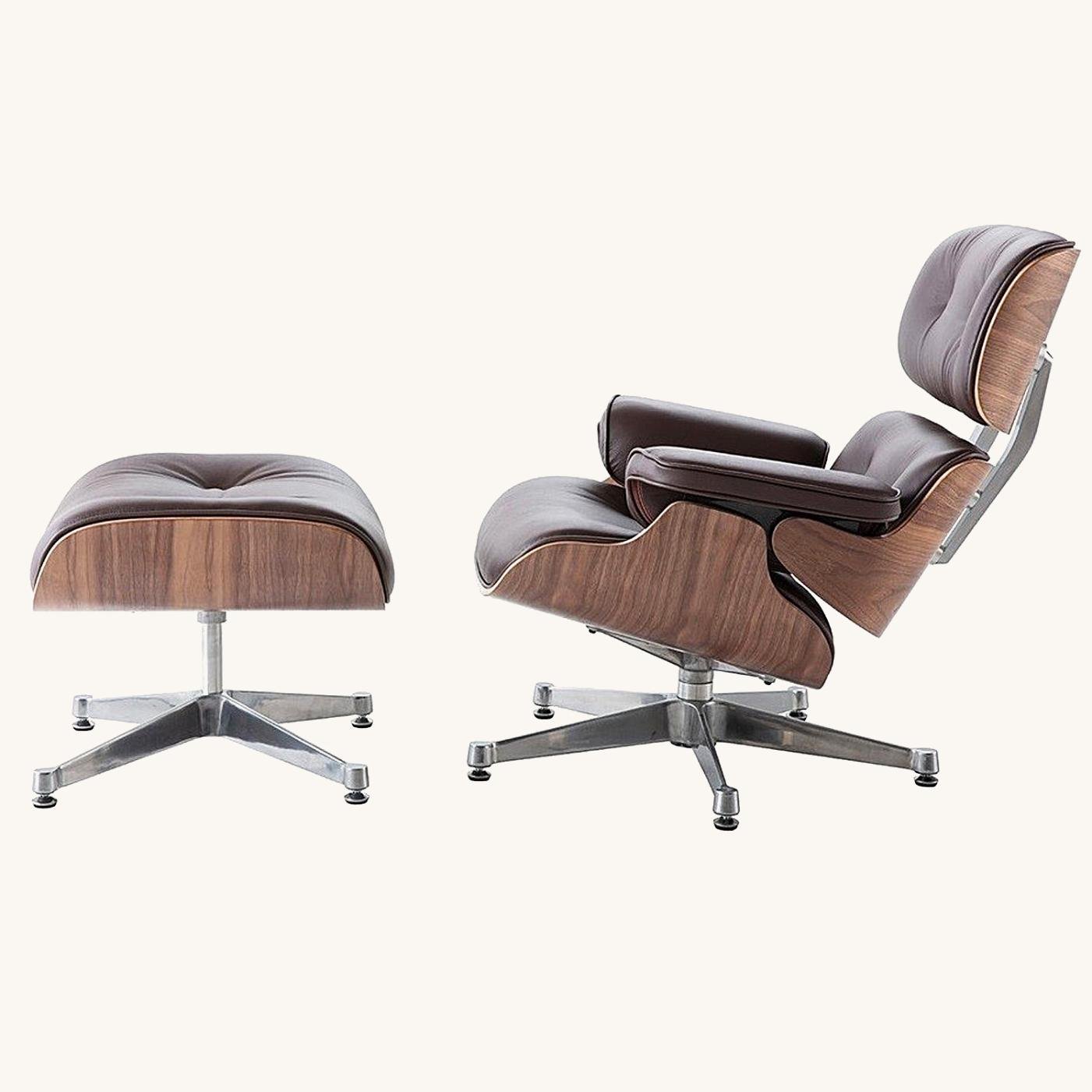 Dark brown leather Eames lounge chair and ottoman on a chrome base, walnut shell in a modern room.