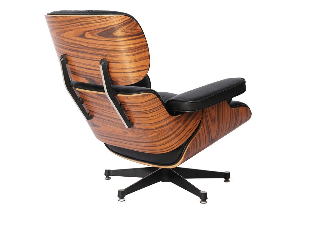 Rosewood palisander veneer on a black Eames lounge chair, deep figured grain up close.