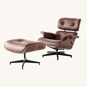 Eames lounge chair in tan and ottoman leather with a walnut shell and matching ottoman, shown.