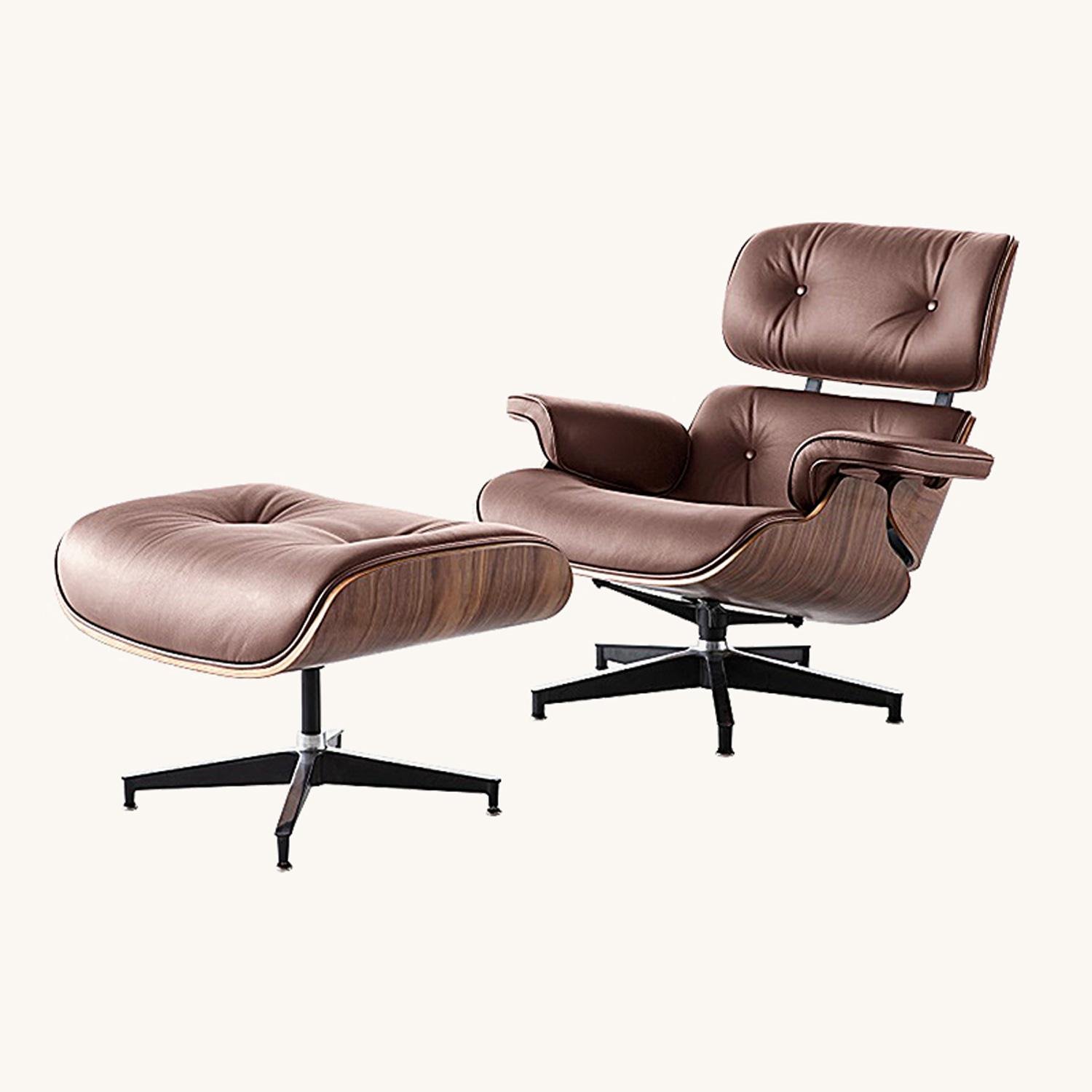 Eames lounge chair in tan and ottoman leather with a walnut shell and matching ottoman, shown.