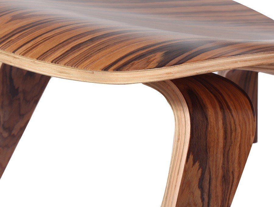 U-shaped moulded plywood legs of an Eames moulded plywood lounge chair replica in rosewood.
