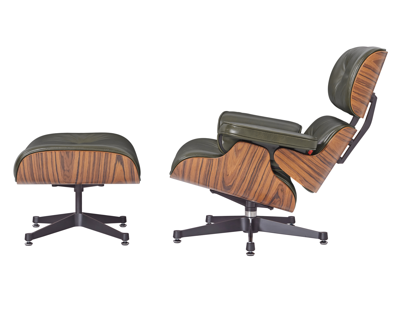 Side profile of a mid-century lounge chair in green leather showing the ergonomic tilt and rosewood veneer support structure.