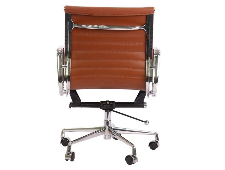 Polished chrome armrest of a tan Eames style ribbed chair, curved aluminium arm.