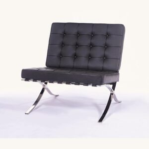 Grey leather Barcelona chair with deep-buttoned tufting on a polished steel X-frame, front view.
