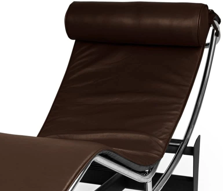 The Le Corbusier LC4 brown cradle glides on the frame, shown set to an upright reading angle.