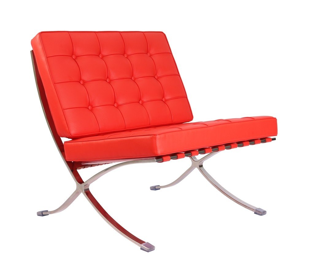 Red Barcelona lounge chair seen from the side, showing the cantilevered X-frame curve.