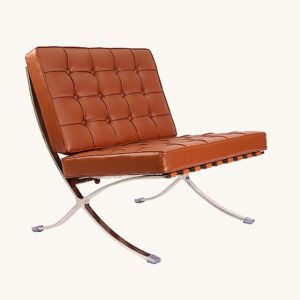 Tan Barcelona chair with deep-buttoned tan leather tufting on a polished steel X-frame, front angle view.