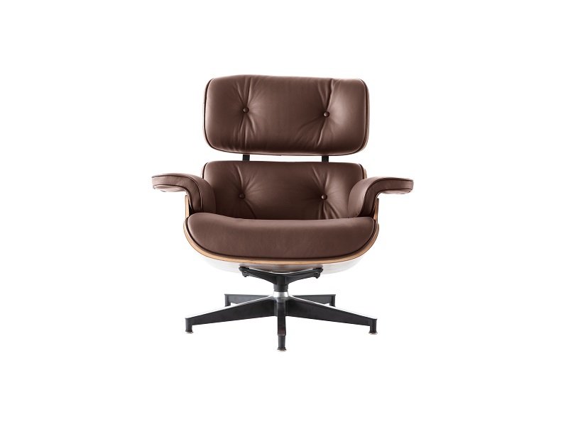 Close-up of tan leather lounge chair cushions, hand-stitched and welted on the seat and back.