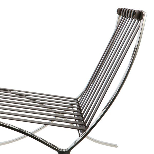 Warm brown Barcelona chair seat cushion resting on the leather support straps, close-up.