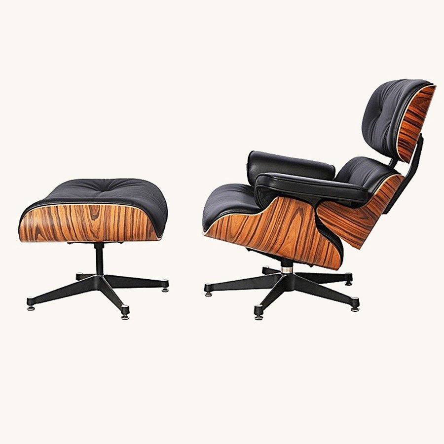 osewood Eames lounge chair and ottoman in black leather, elephant base, styled in a study.